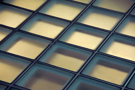 Background of glass squares floor lit from below