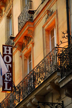 Hotel building in Paris France with wrought iron balconiesの写真素材