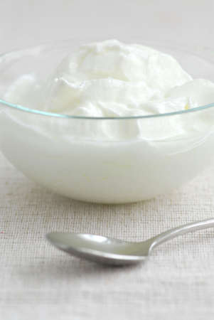 Fresh yogurt served in a clear glass bowlの写真素材