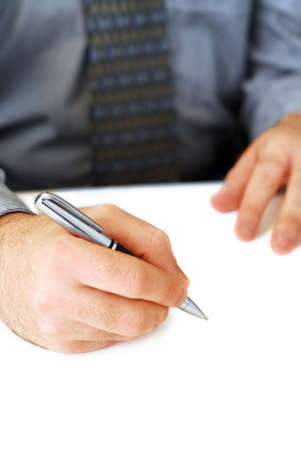 Closeup of businessman's hands on white background holding a pen