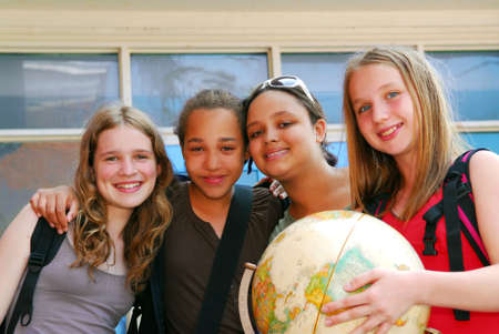 Portrait of a group of young smiling school girlsの写真素材