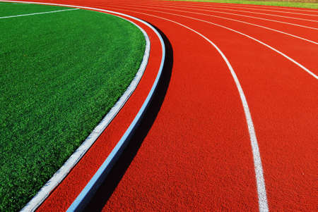 Curving lanes of a red race track 