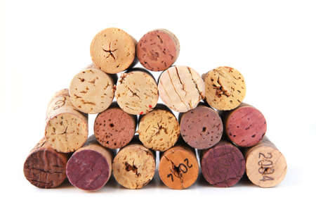 A pile of various wine corks on white backgroundの写真素材