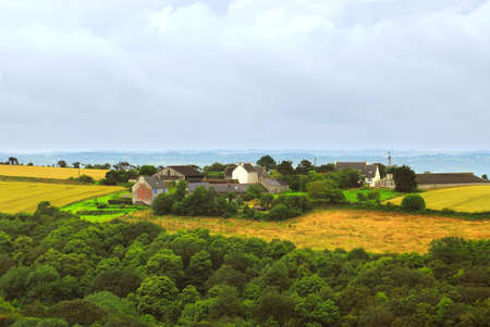 Scenic view on agricultural landscape with a farm house in rural Brittany, Franceの写真素材
