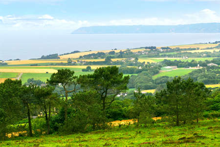 Agricultural landscape with scenic ocean view in rural Brittany, Franceの写真素材