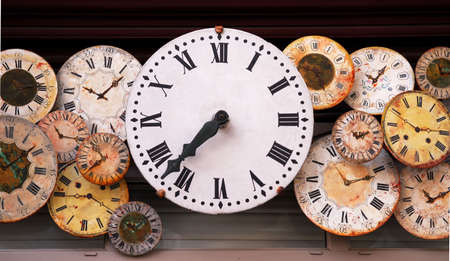 Several antique clock faces of different sizes and stylesの写真素材