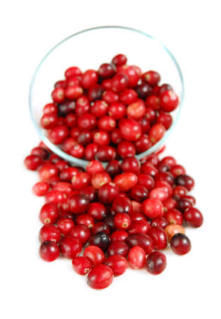 Fresh red cranberries in a glass bowl on white backgroundの写真素材