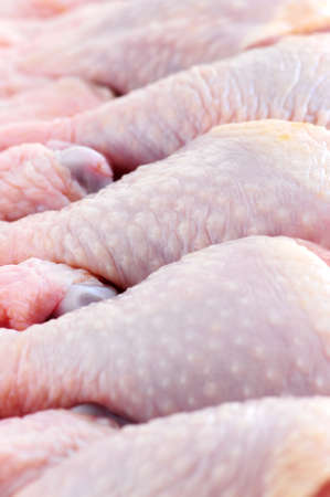 Raw chicken drumsticks in a supermarket packageの写真素材