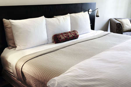 Bedroom with comfortable bed in neutral colors