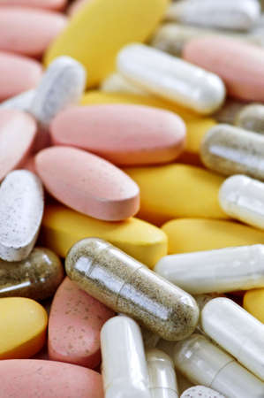 Mix of vitamins and herbal supplements close up