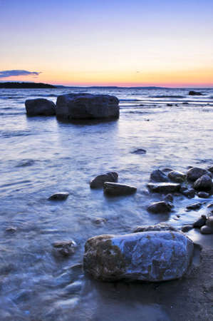 Sunset at the rocky shore of Georgian Bay, Canada. Awenda provincial park.の写真素材