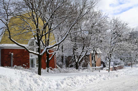Winter street with lots of snow and colorful houses in Toronto