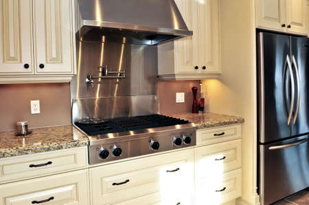 Interior of modern luxury kitchen with stainless steel appliances