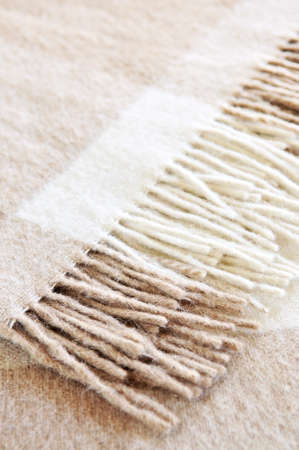 Soft and warm folded alpaca wool blanket with fringe