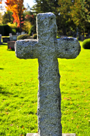Bright graveyard lawn with ancient tombstone crosses