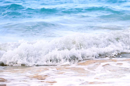 Tropical Caribbean sea waves breaking on the shore