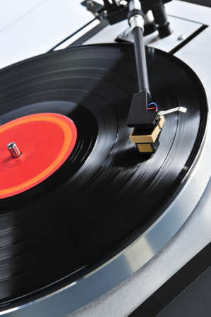 Vinyl record spinning on turntable close up