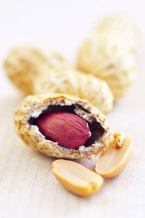 Closeup of peanuts with and without shells