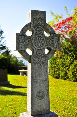 Bright graveyard lawn with ancient celtic crossesの写真素材