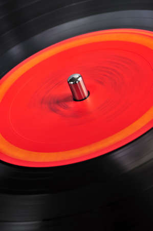 Vinyl record spinning on turntable close upの写真素材