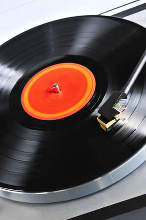 Vinyl record spinning on turntable close up