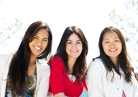Group of three diverse young girlfriends smilingの写真素材