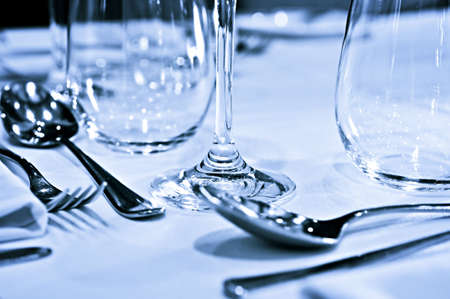 Close up view of table setting with cutlery and glassesの写真素材