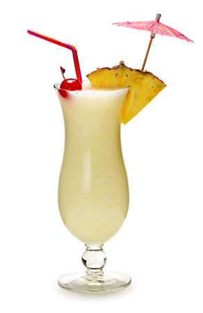 Pina colada drink in hurricane cocktail glass isolated on white backgroundの写真素材