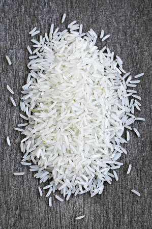 Pile of raw long grain white rice grainsの写真素材