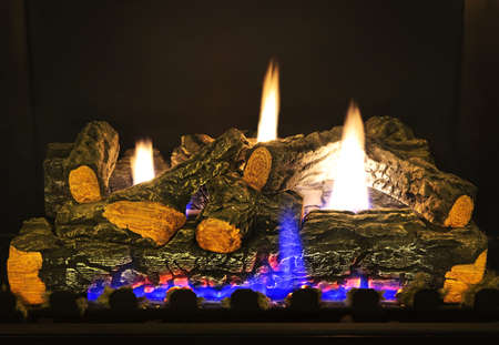 Close up of logs in gas fireplaceの写真素材