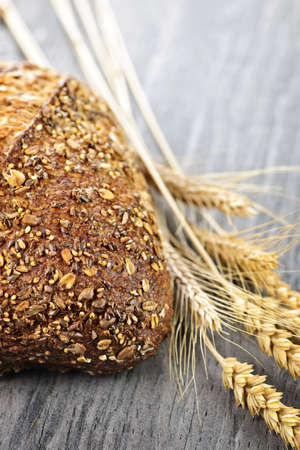 Loaf of fresh baked multigrain bread with grain ears