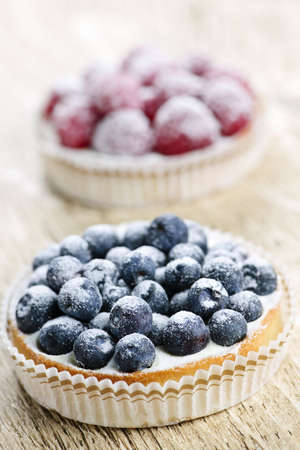 Closeup of fancy gourmet fresh berry dessert tartsの写真素材