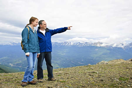 Father and daughter enjoying scenic Canadian Rocky Mountains view in Jasper National parkの写真素材