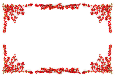 Red winterberry Christmas frame with holly berries on branchesの写真素材