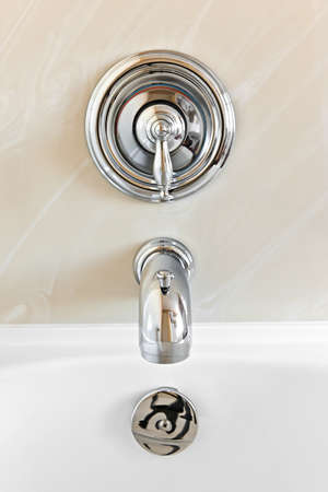 Closeup of shiny chrome bathtub tap fixtureの写真素材