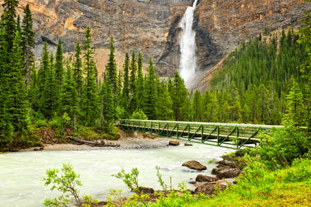 Takakkaw Falls waterfall and footbridge in Yoho National Park, British Columbia, Canadaの写真素材