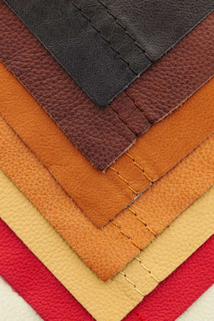 Natural leather upholstery samples with stitching in various colorsの写真素材
