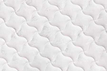 Background of soft comfortable quilted white mattressの写真素材