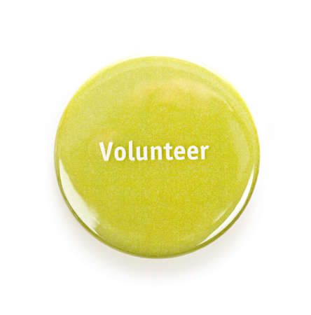 Green round volunteer button isolated on whiteの写真素材