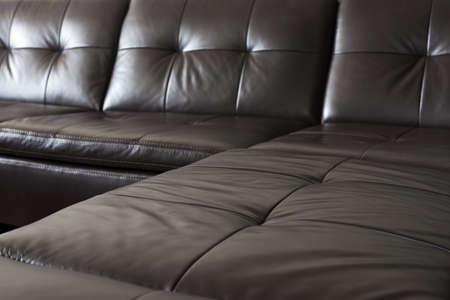 Closeup of luxurious expensive black leather couchの写真素材