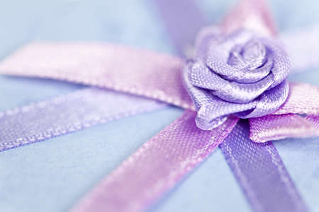 Closeup of pink gift ribbon and bow on presentの写真素材