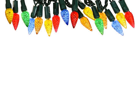 Multicolored string of Christmas lights isolated on white backgroundの写真素材