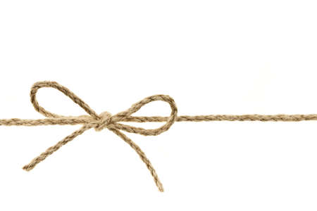 Closeup of braided twine tied in a bow knot isolated on white backgroundの写真素材