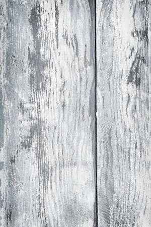 Textured background of distressed rustic wood with peeling blue and white paintの写真素材