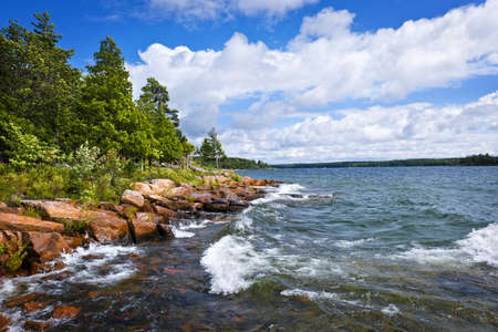 Rocky lake shore of Georgian Bay in Killbear provincial park near Parry Sound, Ontario, Canada.の写真素材