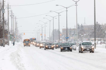 TORONTO, CANADA  FEBRUARY 5, 2014  Traffic on Kingston Road during winter snowstorm on Wednesday, February 5, 2014 in Toronto  Drivers cope with hazardous conditions during the 2014 polar vortex のeditorial素材