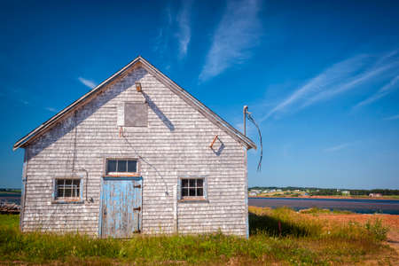 Old building on Atlantic shore in North Rustico, Prince Edward Island, Canada.の写真素材