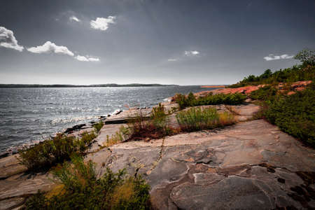 Georgian Bay landscape with rugged rocky lake shore near Parry Sound, Ontario, Canada.の写真素材