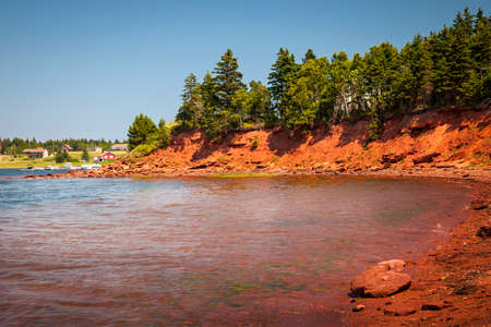Red cliffs of Prince Edward Island Atlantic coast near Cavendish, PEI, Canada.の写真素材