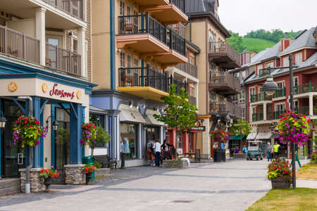 COLLINGWOOD, ON, CANADA - JUNE 18: Shops and restaurants on pedestrian street at Blue Mountain Village in summer, 2014のeditorial素材